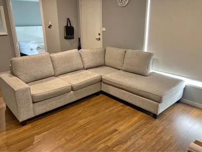 L-shaped sectional sofa — light grey listing photo